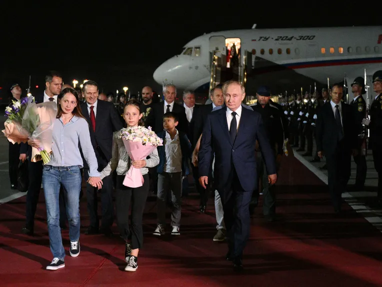 Putin received the released U.S. prisoners at a Moscow airport on Thursday.